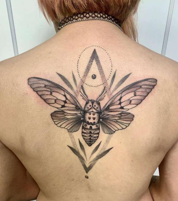 Geometric cicada back tattoo
