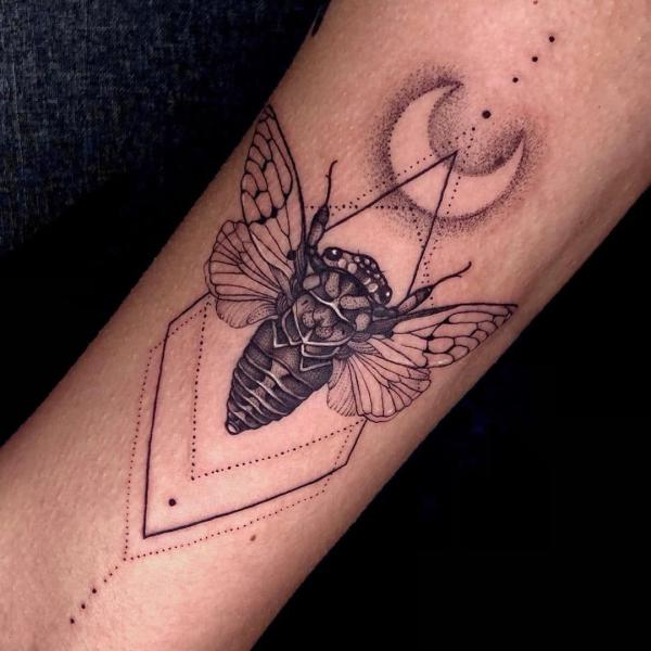 Geometric cicada with crescent moon tattoo
