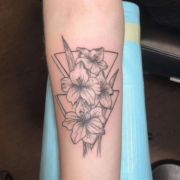Geometric gladiolus flower forearm tattoo