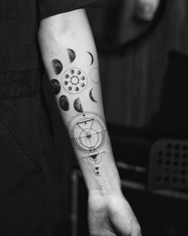 Geometric moon phases forearm tattoo