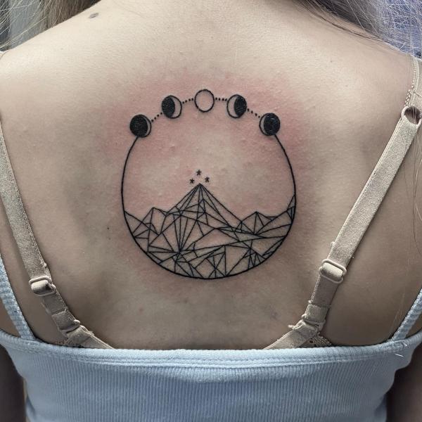 Geometric mountain and moon cycle tattoo