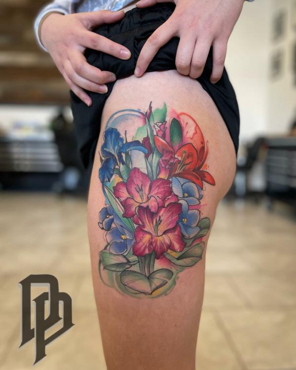 Gladiolus and iris thigh tattoo