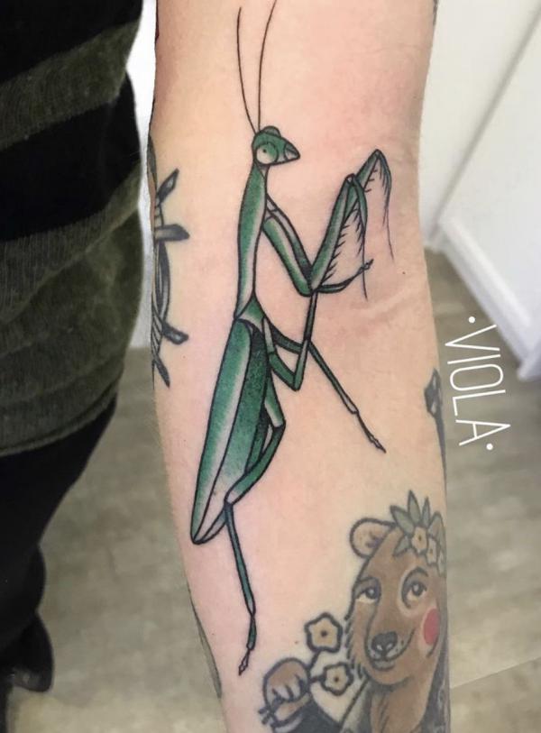 Green Praying mantis arm tattoo