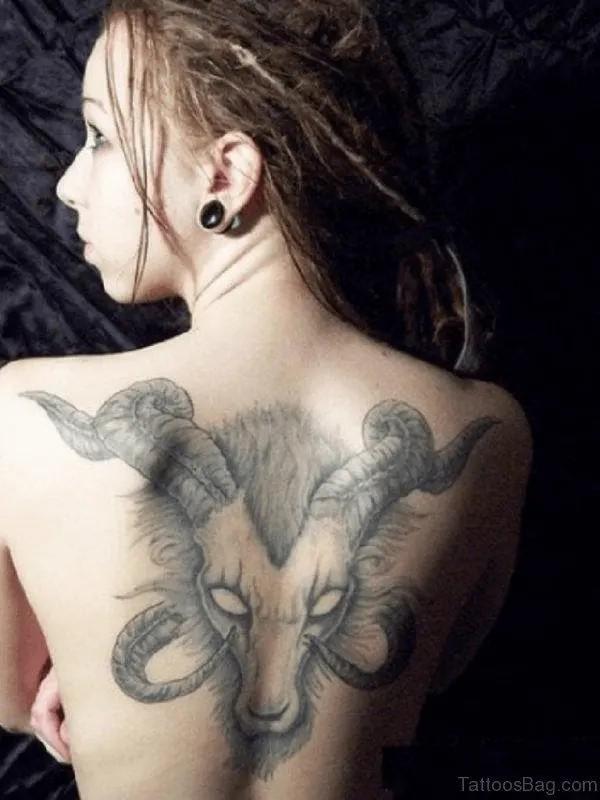 Greyscale Aries ram back tattoo