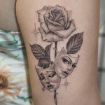 Greyscale laugh now cry later tattoo with rose back of arm tattoo