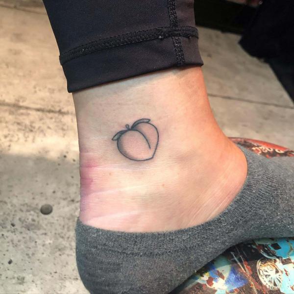 Greyscale peach ankle tattoo