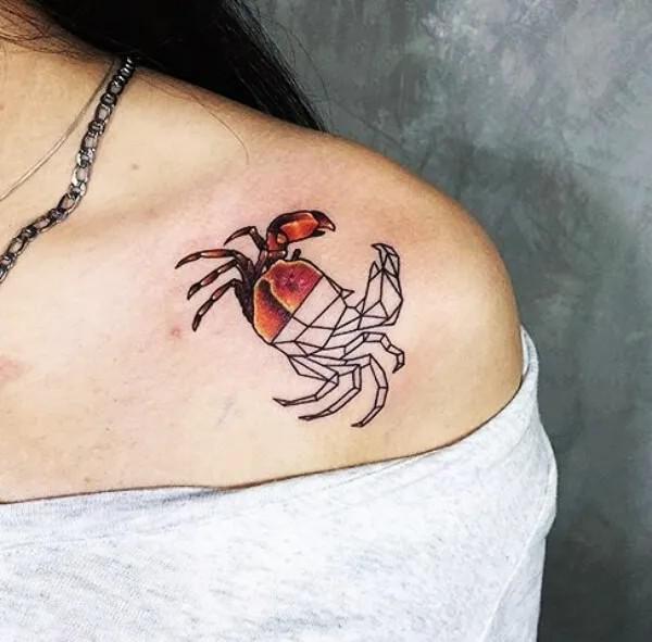 Half crab half geometric Zodiac cancer tattoo on shoulder