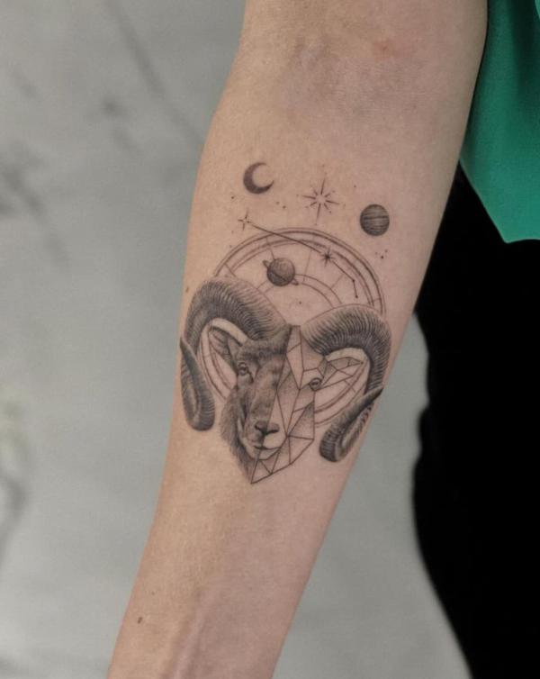 Half realistic half geometric Aries ram head with planets tattoo