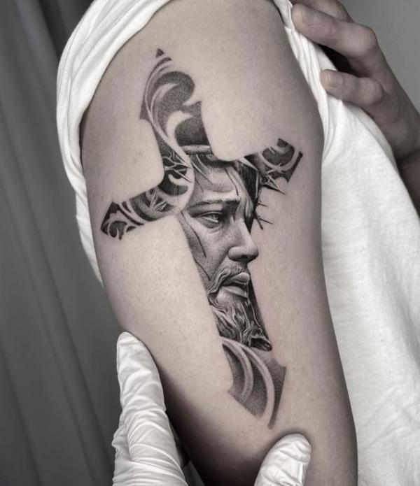 Half sleeve cross tattoo with jesus face