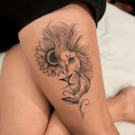 Half sunflower half Leo lion thigh tattoo