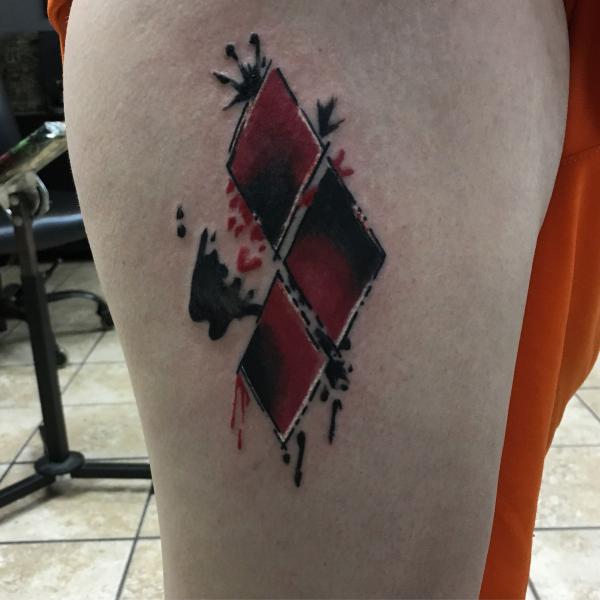 Harley Quinn diamond tattoo on thigh
