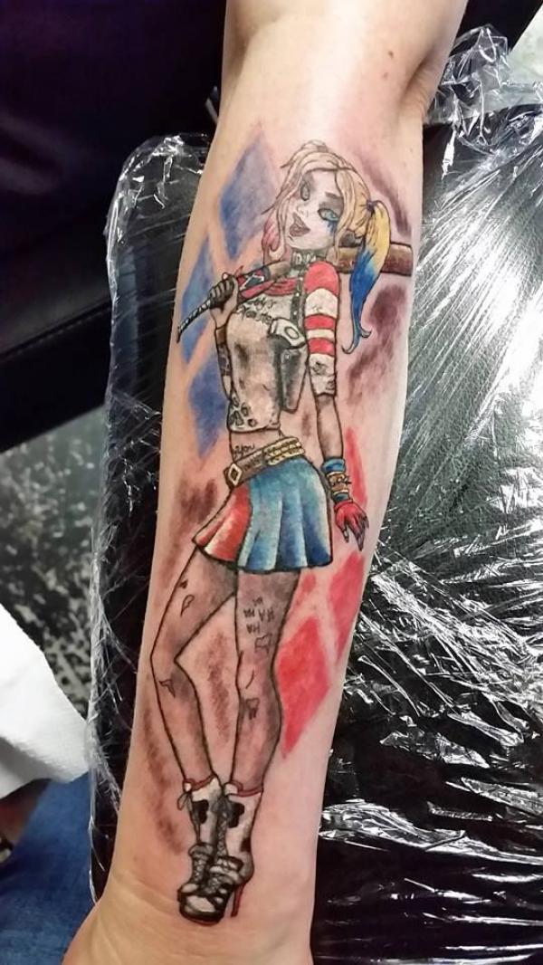 Harley Quinn with her baseball bat forearm tattoo