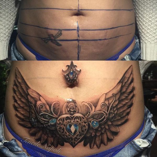 Heart with wings tummy tuck tattoo