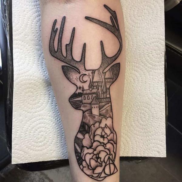 Hogwarts School patronus stag with deathly hallows tattoo