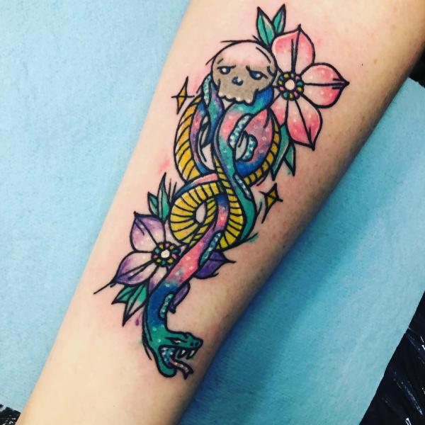 Illustrative death eater with flower tattoo