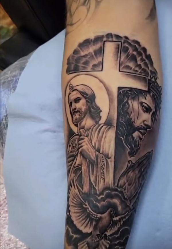 Jesus and San Judas with cross and dove tattoo