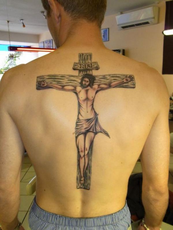 Jesus on INRI cross tattoo on back