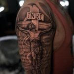 Jesus on INRI cross with Bible verse tattoo