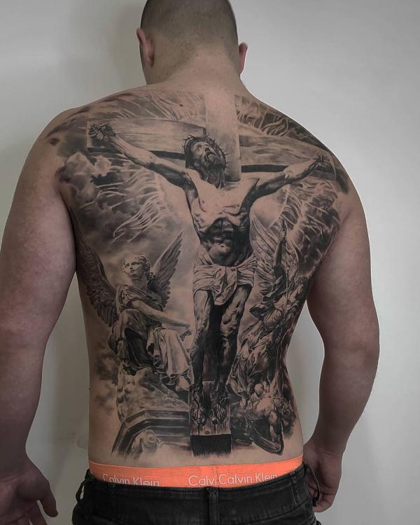 Jesus on cross with Angel tattoo on back