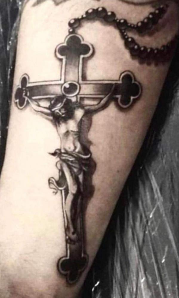 Jesus on cross with rosary tattoo