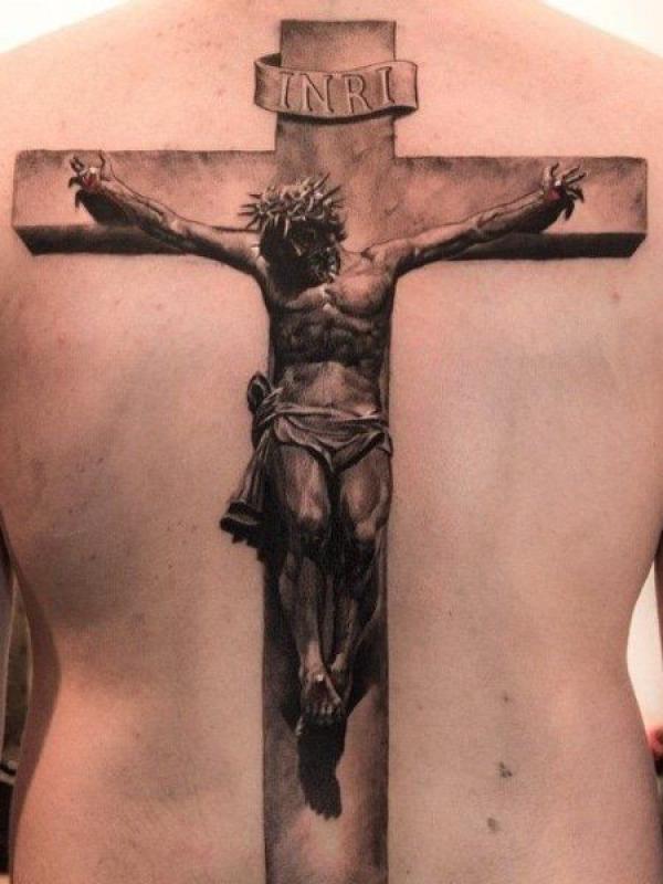 Jesus with thorn crown ons INRI cross tattoo on back