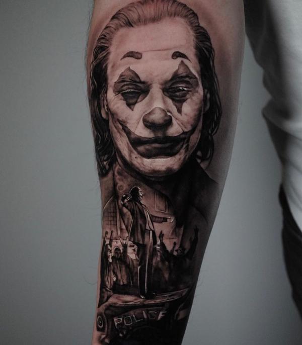 Joaquin Phoenix joker forearm tattoo black and white