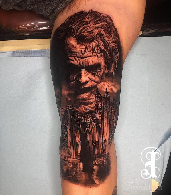 Joker and city leg tattoo