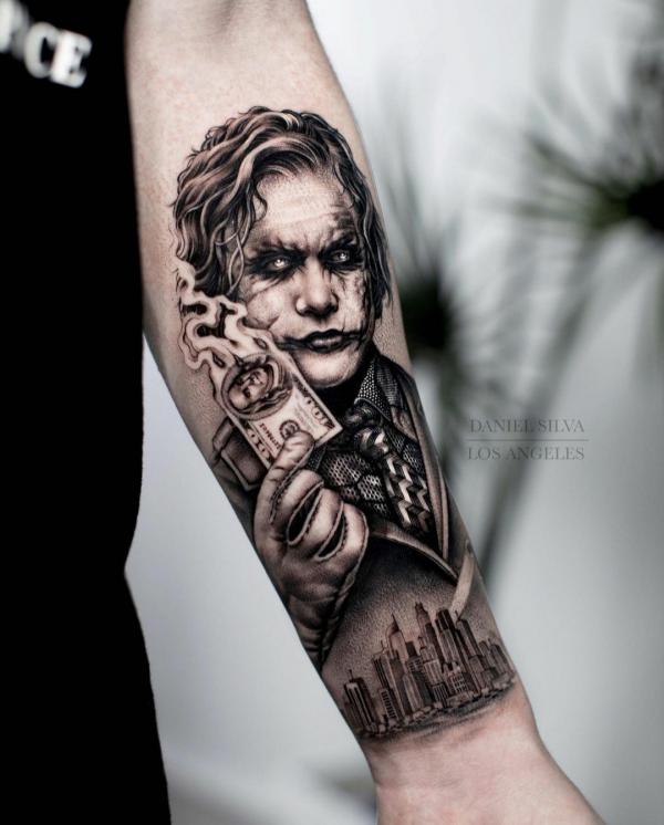 Joker burning money tattoo