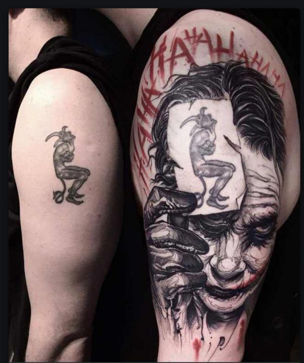 Joker cover up tattoo on upper arm