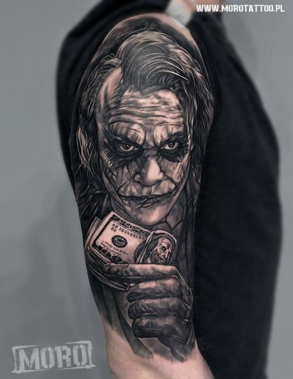 Joker holding money half sleeve tattoo