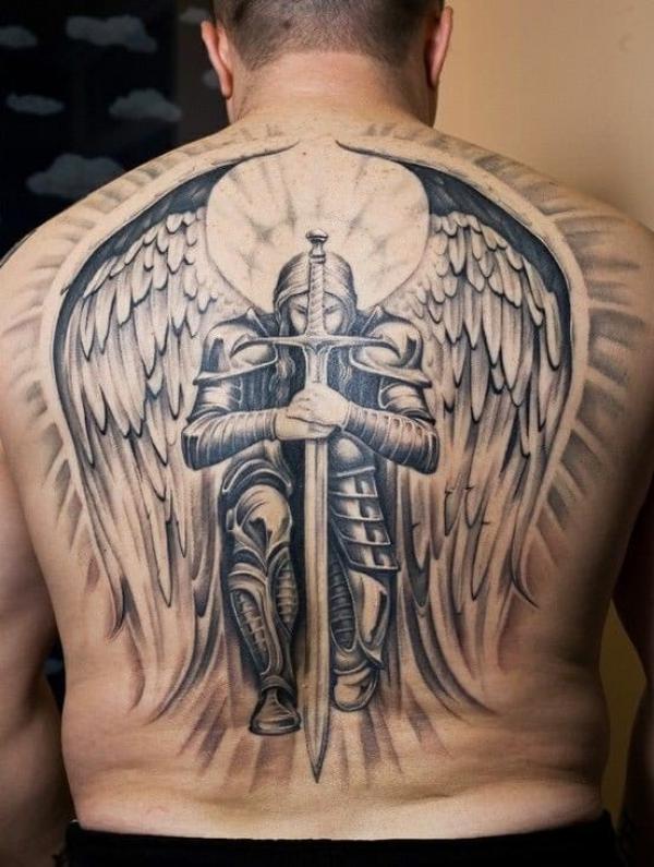 Kneeling Saint Michael with wings back tattoo