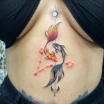 Koi fish Picses constellation with sun and moon stomach tattoo