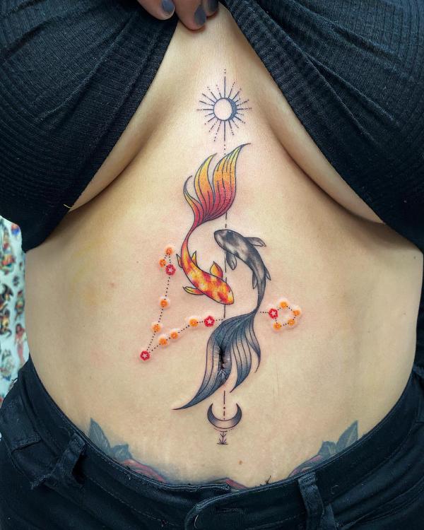 Koi fish Picses constellation with sun and moon stomach tattoo