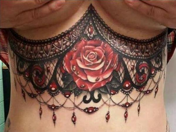 Lace with rose stomach tattoo