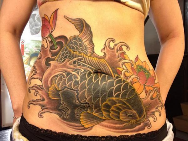 Large koi fish stomach tattoo