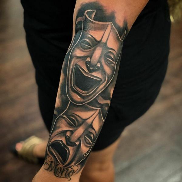 Laugh Now Cry Later outer forearm tattoo