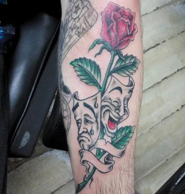 Laugh now cry later with a stem of rose tattoo