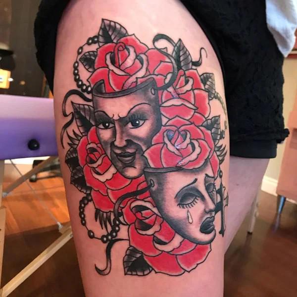 Laugh now cry later with traditional rose tattoo