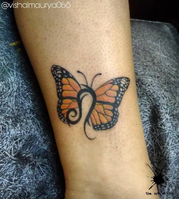 Leo butterfly tattoo