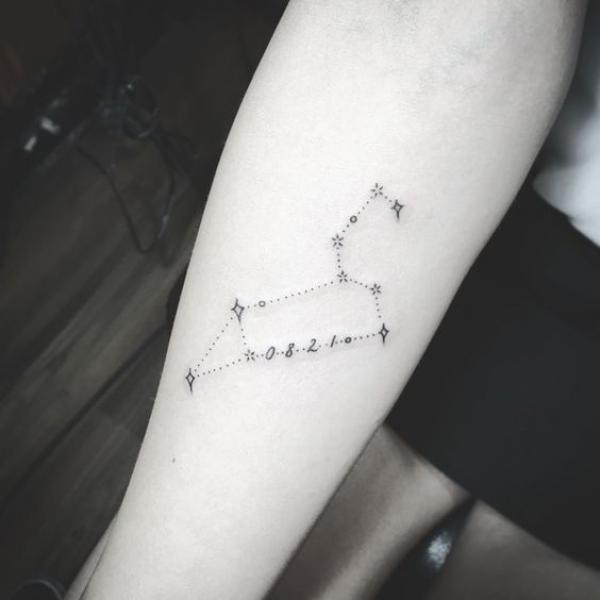 Leo constellation tattoo on inner forearm