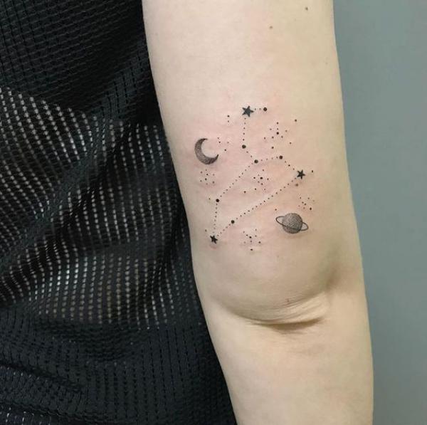 Leo constellation with earth moon and stars tattoo