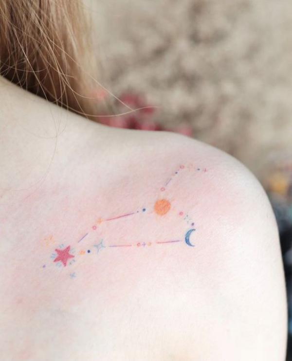Leo constellation with sun and moon tattoo