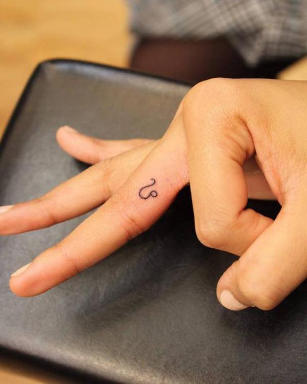 Leo finger tattoo