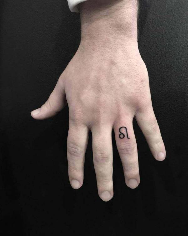 Leo glyph finger tattoo