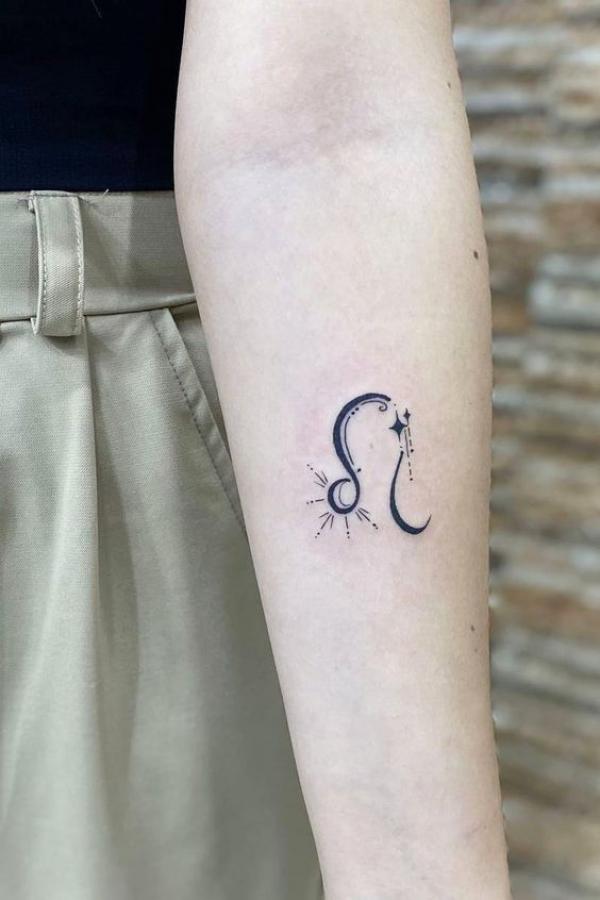 Leo glyph with shooting star tattoo