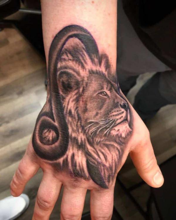 Leo lion hand tattoo