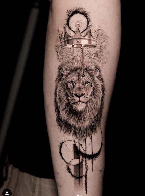Leo lion king with crown tattoo