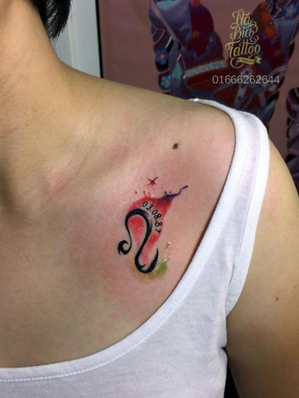 Leo sign with date tattoo