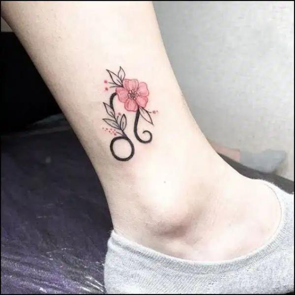 Leo sign with flower ankle tattoo