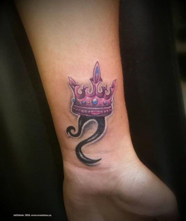 Leo sign with queen crown wrist tattoo